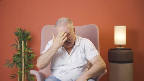 Old-man-with-migraine-is-experiencing-pain.